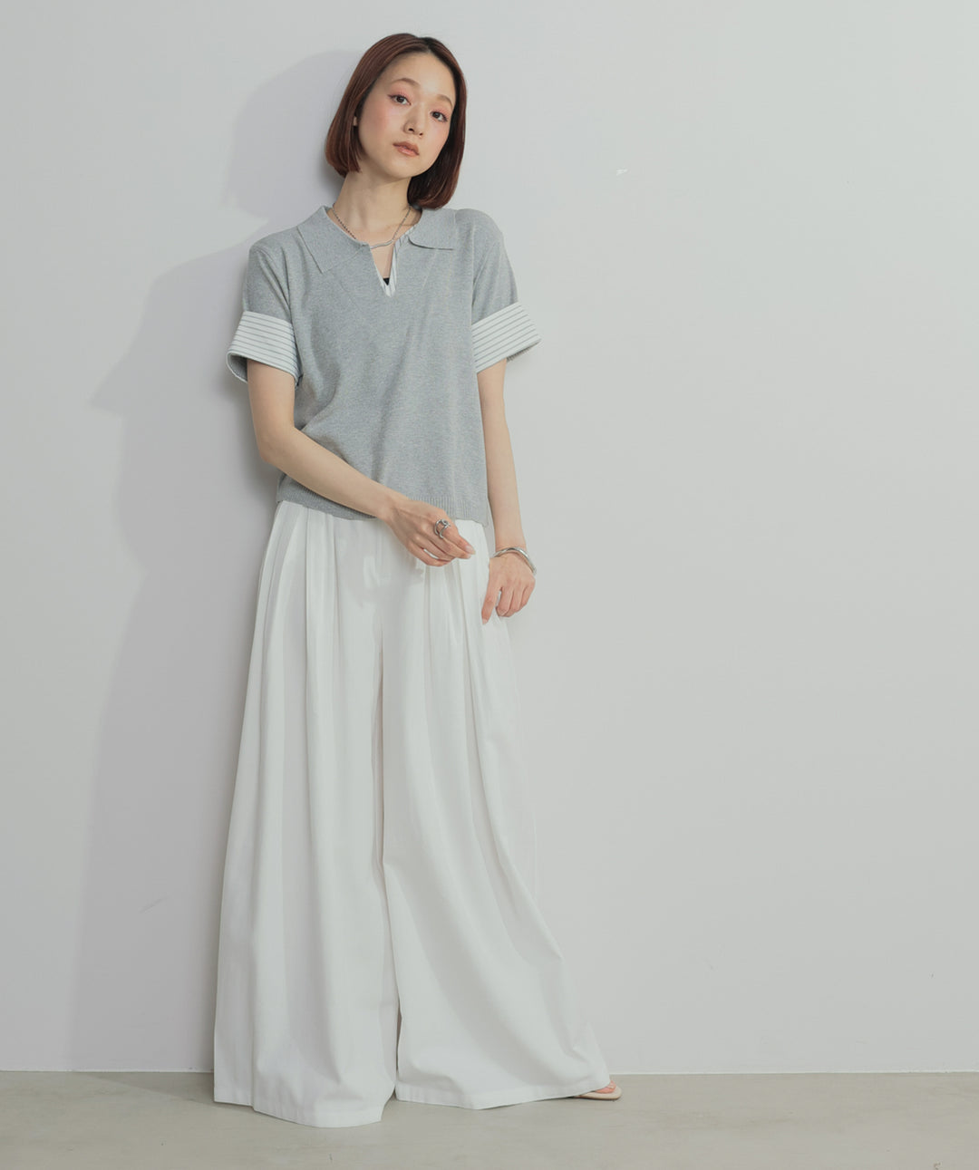 レイヤードポロニットトップス