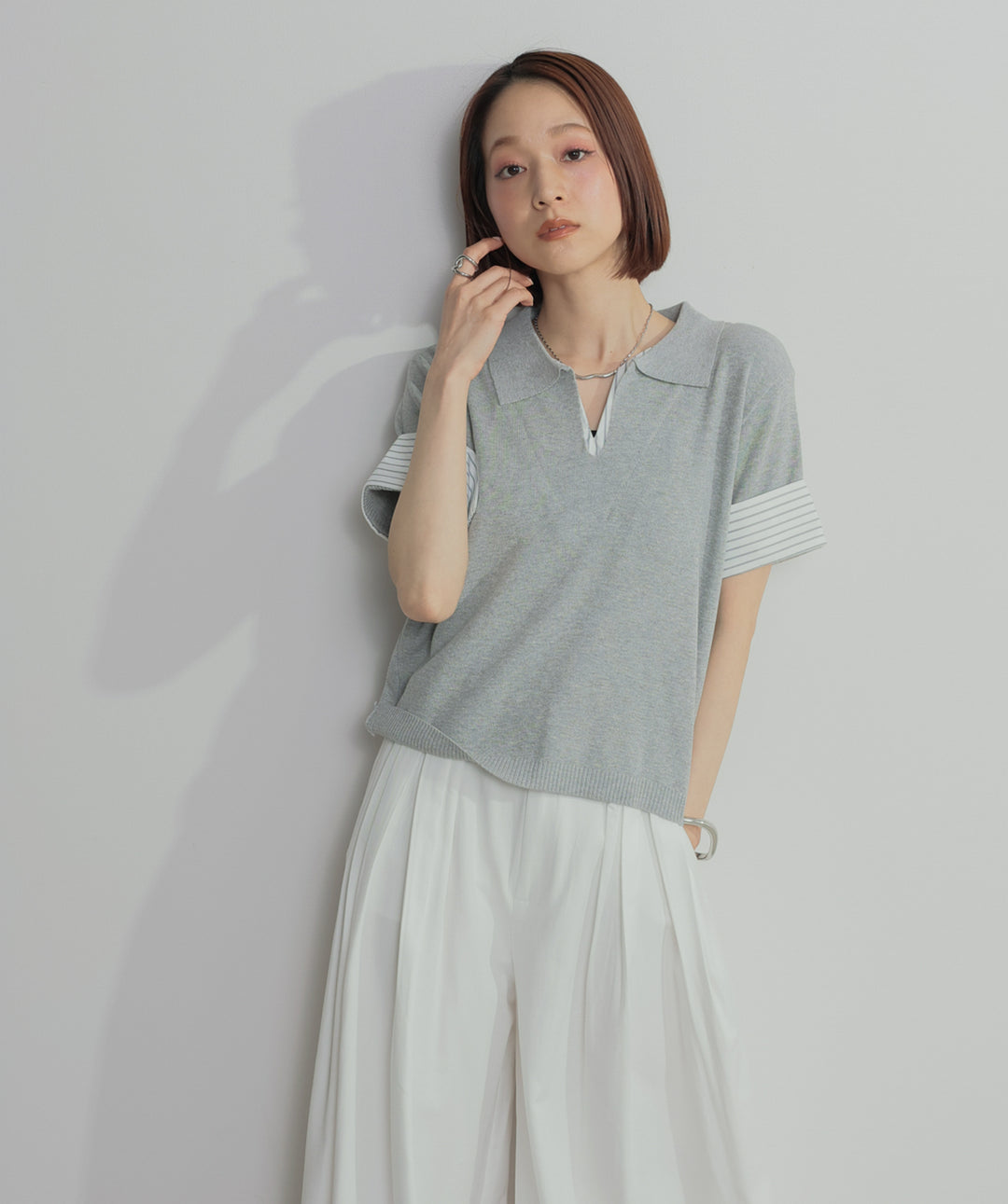 レイヤードポロニットトップス