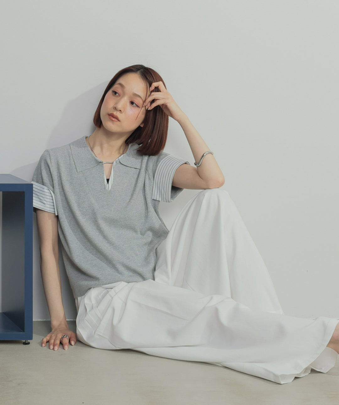 レイヤードポロニットトップス