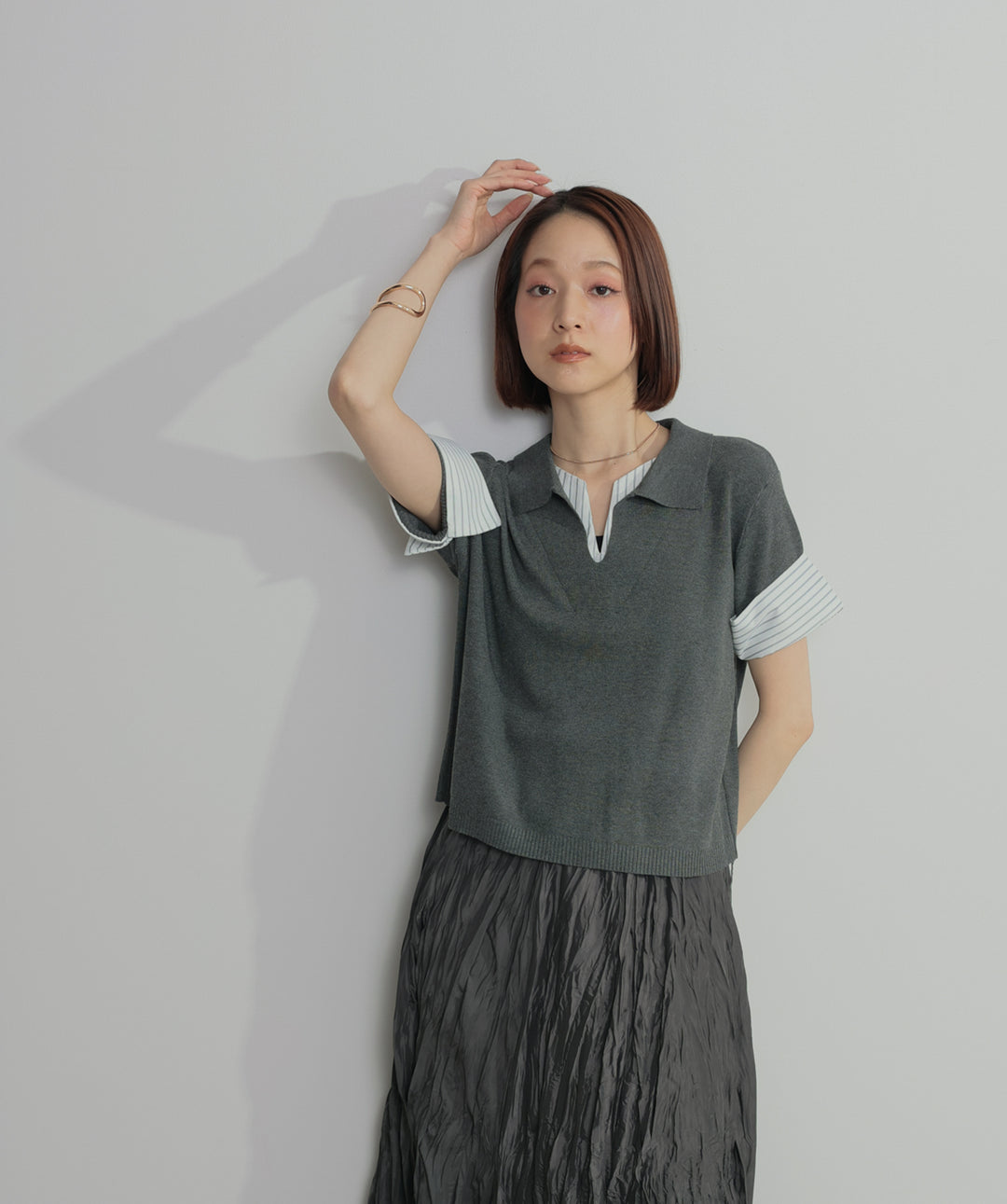 レイヤードポロニットトップス