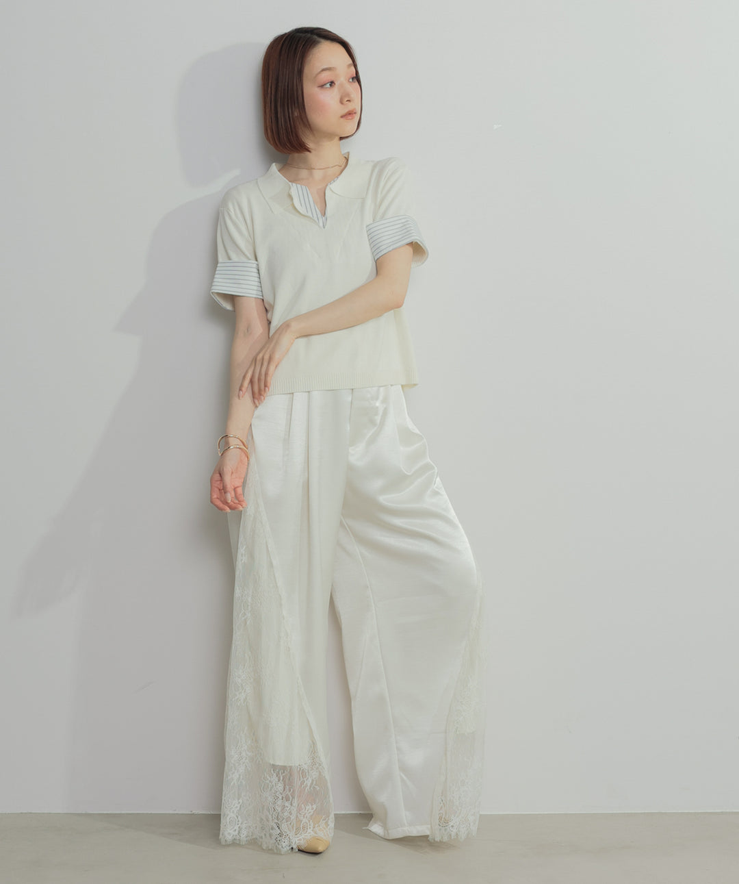 レイヤードポロニットトップス